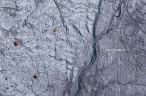 Aerial view of cryconites and meltwater streams on the Greenland Ice Sheet surface, showing how dark microbial colonies and impurities accelerate melting.